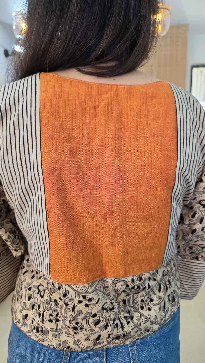 Cream kalamkari & orange self-woven fabric