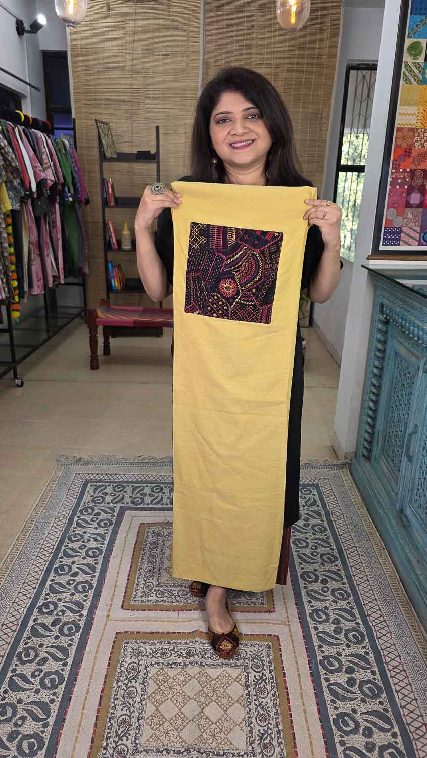 Yellow with Lambani handwork in the front and back.